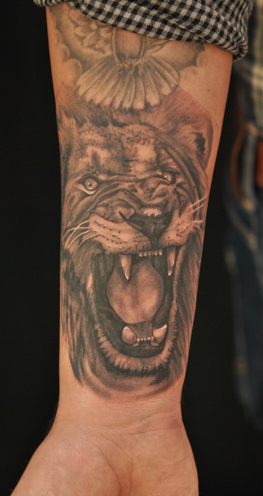 Angry Lion Tattoo on Hand