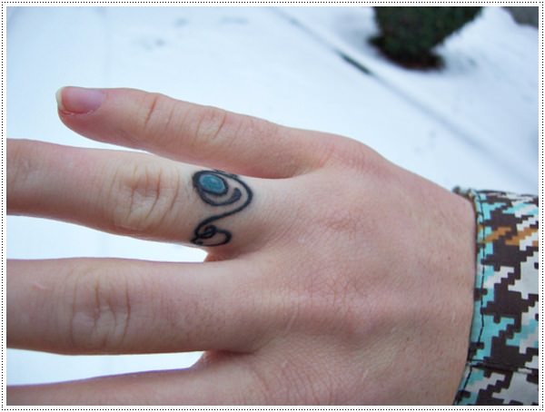 A black ring tattoos for girl