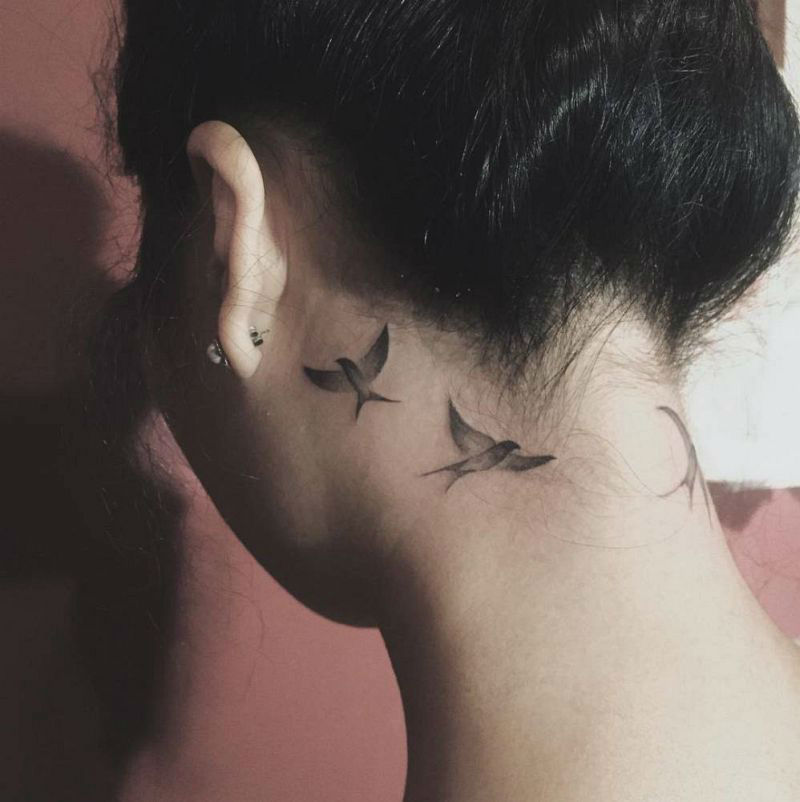 Neck tattoo with small, shaded birds