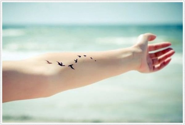 Small bird tattoos for girl on hand