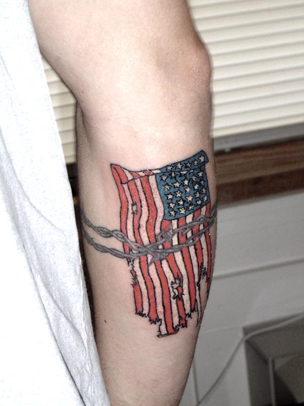 Tattered American Flag Tattoo on Men Hand