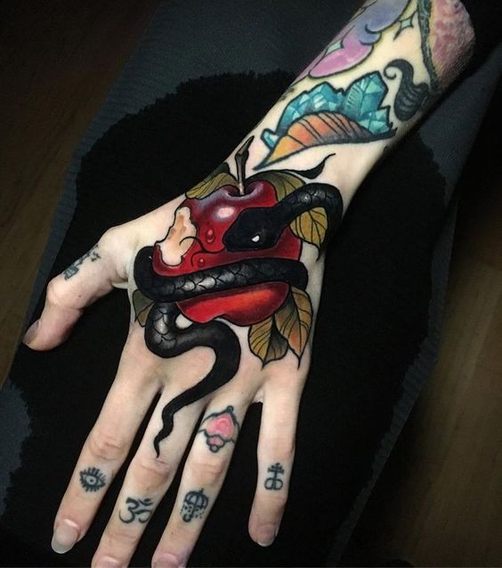 Forbidden Fruit hand tattoo