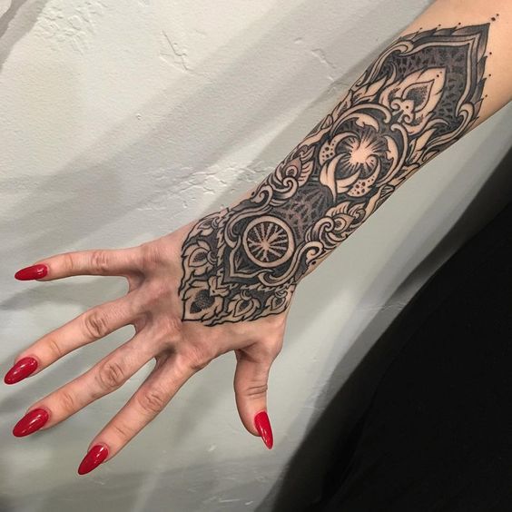 Ornamental Hand Forearm Piece tattoo