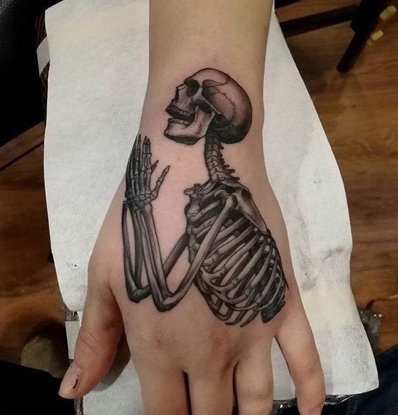 Skeleton at Prayer hand tattoo
