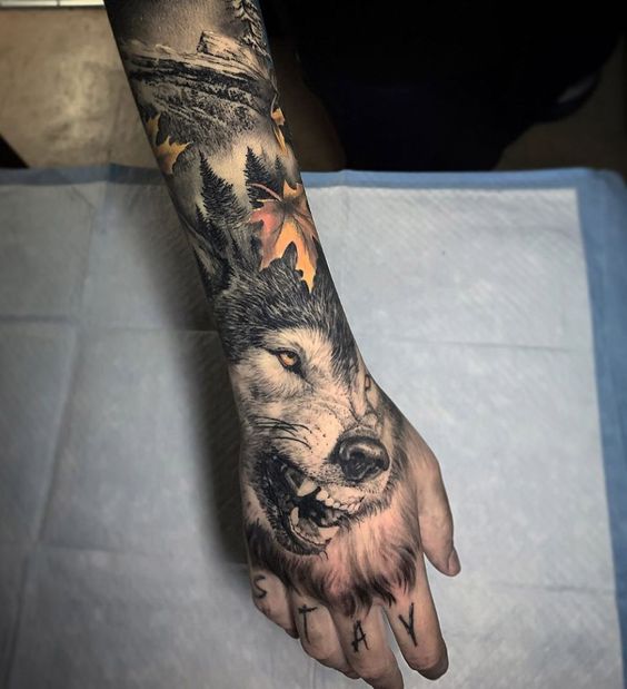 Snarling Wolf Hand Tattoo