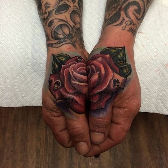 Split Rose Thumbs tattoo
