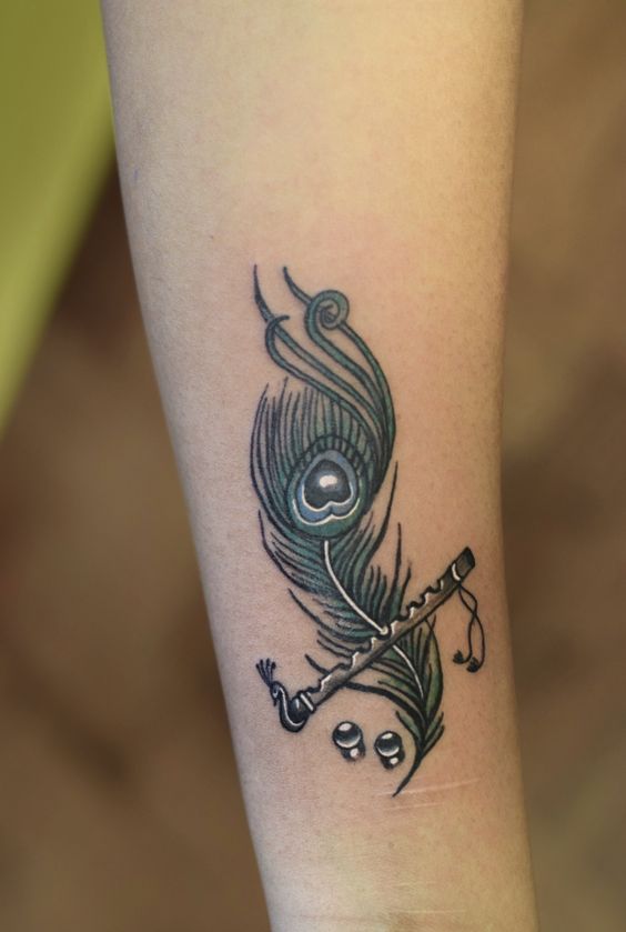Krishna Tattoo  What Does a Tattoo Say About a Person  Krishna tattoo  Tattoos Feather tattoos