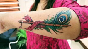 Peacock Feather Tattoo with Flute
