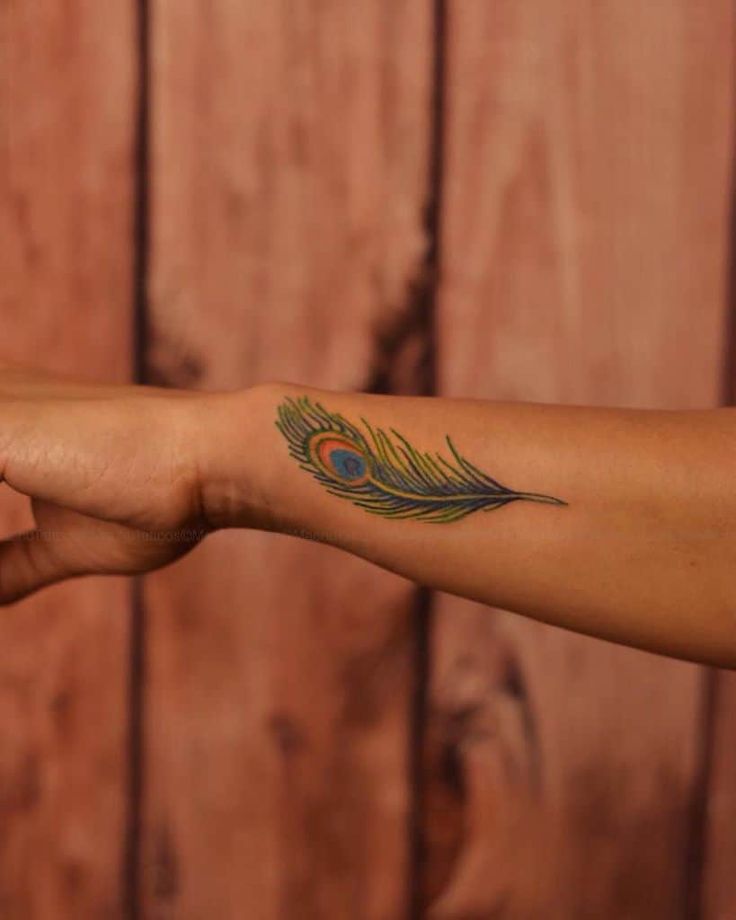 Wrist Peacock Feather Tattoo